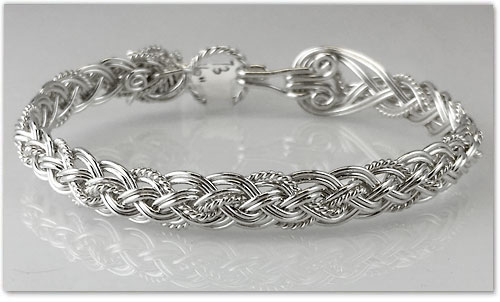 <strong>Sterling Silver Bracelet</strong><br>
Height: 11 mm.<br>Size: from 6 ½ to 7 in.<br>
By Varsha Titus